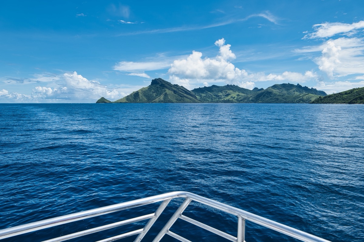 View from the bow of a fast boat towards a Yasawa island during the crossing